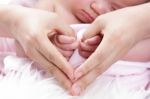 Parent Cover Their Baby Hand Stock Photo