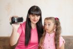 Mom Showing Her Little Daughter Where Babies Come Stock Photo