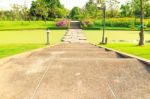 Stone Walkway Across Water In The Park Stock Photo