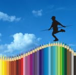 Boy Balancing On Pencil Stock Photo