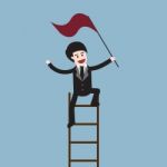 Success Businessman On Ladder Stock Photo