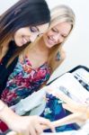 Two Young Friends Looking For Clothes In The Store Stock Photo