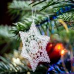 Crocheted Star On A Christmas Tree Stock Photo