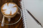 Notebook Pen And Cup Of Coffee Stock Photo