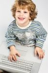 Happy Boy With Laptop Stock Photo