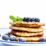 Pile Of Pancakes With Blueberries Sprinkled With Icing Sugar And Stock Photo