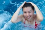 Asian Woman Enjoy And Relaxing In Spa Pool On Vacation Stock Photo