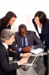 Multi Ethnic Team During Meeting Stock Photo