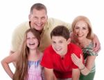 Happy Family Smiling Towards The Camera Stock Photo