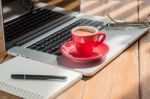 Hot Coffee Cup On Wooden Work Station Stock Photo