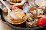 Fresh Clams On An Iron Skillet Stock Photo