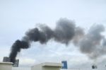 Black Smoke From Fire Burning On The Sky Stock Photo