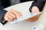 Businessman Finger Pointing To The Screen Of A Digital Tablet Stock Photo