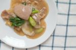 Rad Na, Famous Thai Chinese Style Wide Rice Noodle Dish With Tasty Tender Pork With Thick Gravy Sauce. Close Up Stock Photo