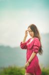 Beautiful Young Attractive  Asian Women In Red Dress On Sunrise Beautiful Nature Background Of The Mountains And Lotus Garden Image Of Happy  Camping, Travel, Lifestyle Resting , Relaxing Concept Vintage Style Stock Photo