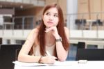 Portrait Of Thai Adult Beautiful Girl Write A Book And Smile In University Stock Photo