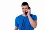 Smart Man Using Telephone Stock Photo