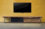 Led Tv On Concrete Wall With Wooden Furniture In Living Room Stock Photo