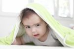 Baby Under Blanket Stock Photo