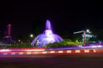 The Fountain At The City Intersection With The Building's Background Towering High Behind Stock Photo