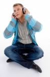 Young Guy Listening To Music With Headphones Stock Photo