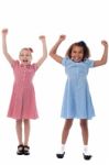 Two Excited Young Girls In Joyous Mood Stock Photo