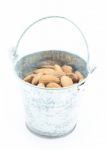 Almonds In Bucket Isolated On White Background Stock Photo