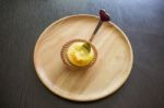 Portuguese Egg Tart On A Wood Dish With White Greeting  Blank Paper Stock Photo