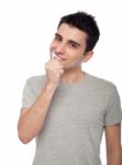 Young Man Brushing Teeth Stock Photo