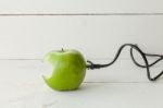 Green Apple Connected To An Ethernet Cable Stock Photo