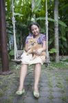 Girl And Pomernian Dog Stock Photo