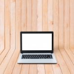 Laptop On Wood Background Stock Photo