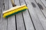 Old Plastic Brush On Wooden Floor Stock Photo