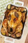 Roasted Chicken With Garlic And Potatoes Stock Photo