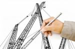 Male Hand Drawing Crane Stock Photo