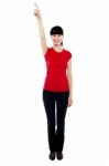 Beautiful Female Model Directing Finger Upwards Stock Photo