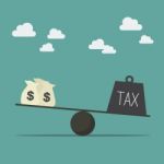 Balancing With Income And Tax Stock Photo