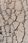 Old Worn And Cracked Asphalt With Cracks Stock Photo