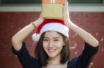 Portrait Of Thai Adult Student University Beautiful Girl Hold Gift Box In Hands Stock Photo