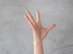 Hand Action Gesture On Grey Background Stock Photo