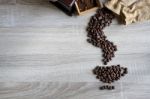 Flat Lay Of  Coffee Beans In Form Of Coffee Pouring From A Sack Stock Photo