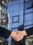 Handshaking Business People Stock Photo