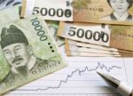 Korean Money With Graph Analysis Stock Photo