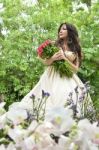 Young Girl Holding Bouquet Stock Photo