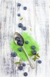 Vintage Spoon With Blueberries On White Wooden Table Stock Photo