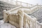 Ice Covered Staircase On The Beach Stock Photo