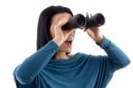 Portrait Of Woman Looking Through Binocular On White Background Stock Photo