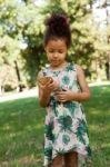 Young Child Using Smartphone At Park Stock Photo