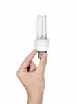 Hand Holding Energy Saving Light Bulb Stock Photo