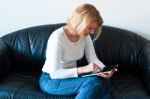 Woman Browsing A Touchscreen Table Stock Photo